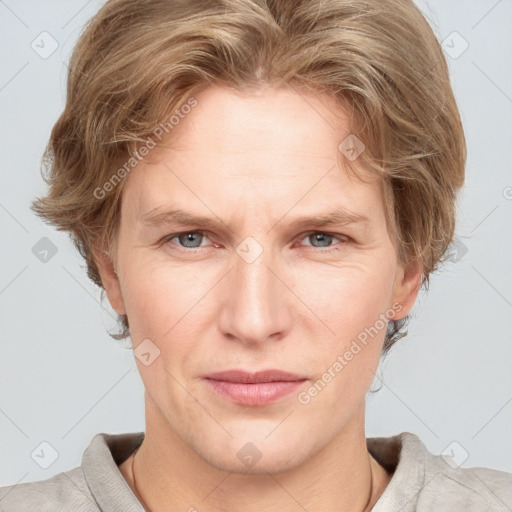 Joyful white adult female with medium  brown hair and blue eyes