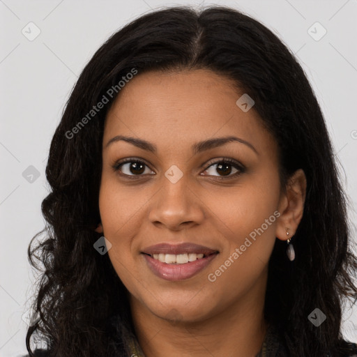 Joyful black young-adult female with long  brown hair and brown eyes