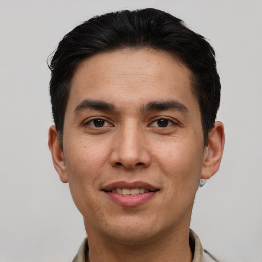 Joyful white young-adult male with short  black hair and brown eyes