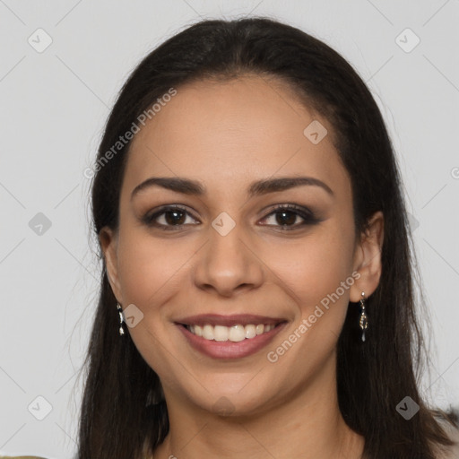 Joyful latino young-adult female with long  brown hair and brown eyes