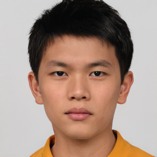 Neutral asian child male with short  brown hair and brown eyes