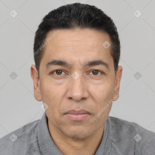 Joyful white adult male with short  black hair and brown eyes