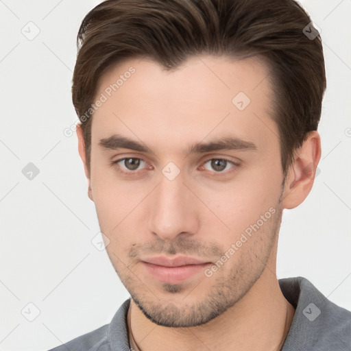 Neutral white young-adult male with short  brown hair and brown eyes