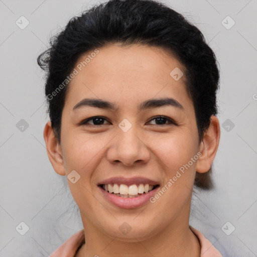 Joyful latino young-adult female with short  brown hair and brown eyes