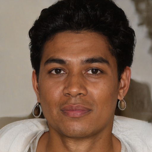 Joyful black young-adult male with short  black hair and brown eyes