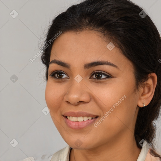 Joyful latino young-adult female with medium  brown hair and brown eyes