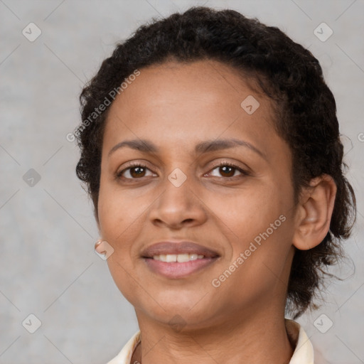 Joyful latino young-adult female with short  brown hair and brown eyes