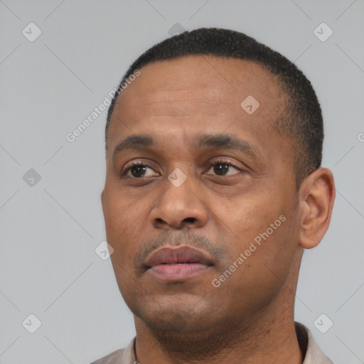Neutral black young-adult male with short  black hair and brown eyes