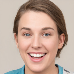 Joyful white young-adult female with medium  brown hair and blue eyes