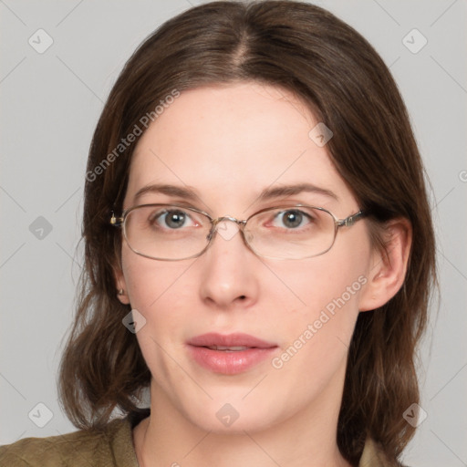 Joyful white young-adult female with medium  brown hair and green eyes