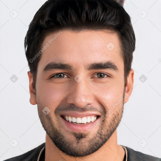 Joyful white young-adult male with short  black hair and brown eyes