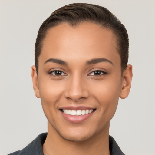 Joyful white young-adult female with short  brown hair and brown eyes