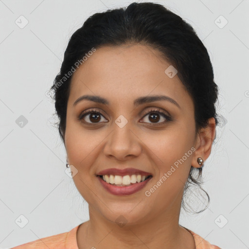 Joyful latino young-adult female with long  brown hair and brown eyes