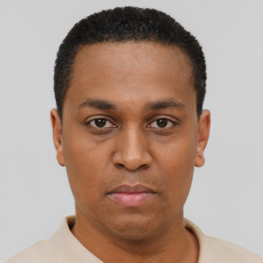 Neutral latino young-adult male with short  brown hair and brown eyes