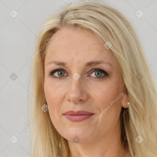 Joyful white adult female with long  brown hair and brown eyes