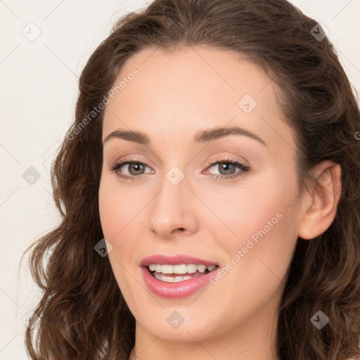 Joyful white young-adult female with long  brown hair and green eyes