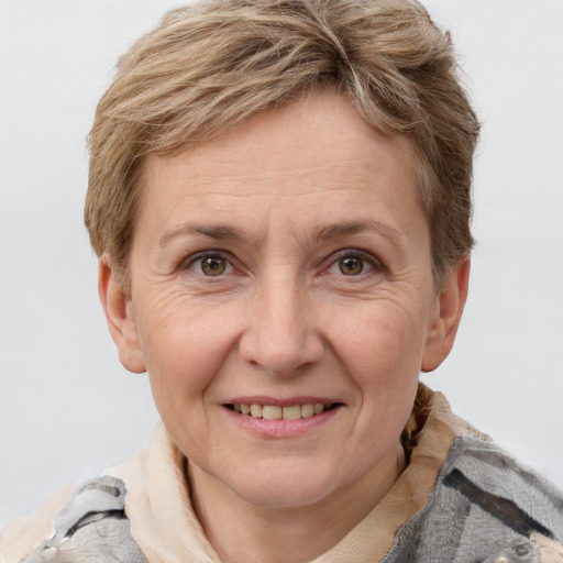 Joyful white adult female with short  brown hair and grey eyes