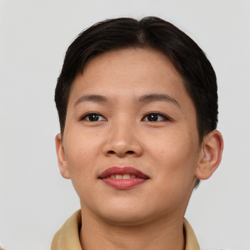 Joyful asian young-adult female with short  brown hair and brown eyes