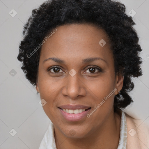 Joyful black adult female with short  brown hair and brown eyes