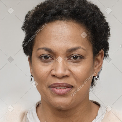 Joyful black adult female with short  brown hair and brown eyes