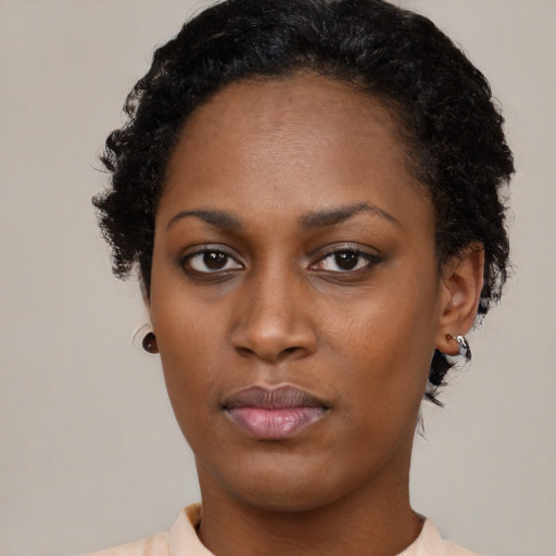 Neutral black young-adult female with short  brown hair and brown eyes