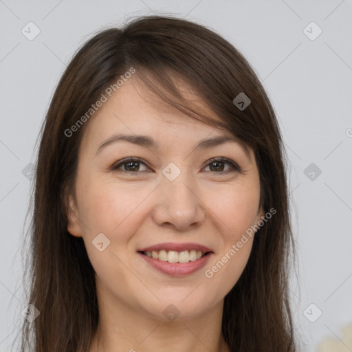 Joyful white young-adult female with long  brown hair and brown eyes