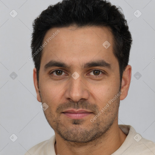 Joyful white young-adult male with short  black hair and brown eyes