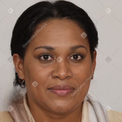 Joyful black adult female with medium  brown hair and brown eyes