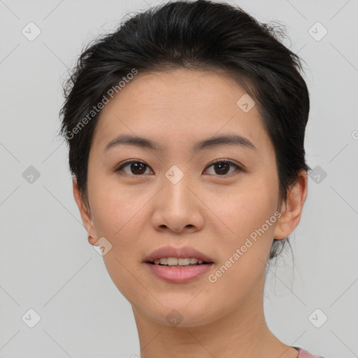 Joyful asian young-adult female with short  brown hair and brown eyes