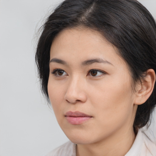 Neutral asian young-adult female with medium  brown hair and brown eyes