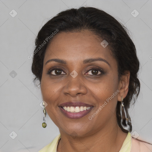 Joyful black young-adult female with medium  brown hair and brown eyes