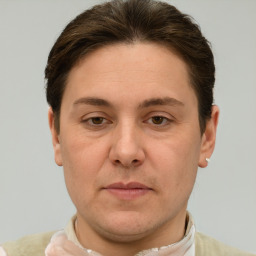 Joyful white adult male with short  brown hair and grey eyes