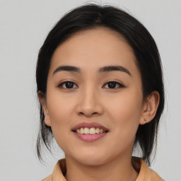 Joyful asian young-adult female with medium  black hair and brown eyes