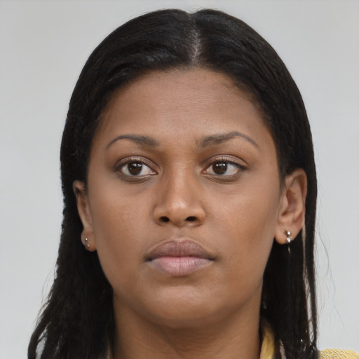 Neutral black young-adult female with long  brown hair and brown eyes