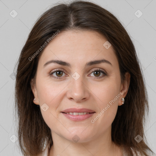 Joyful white young-adult female with medium  brown hair and brown eyes