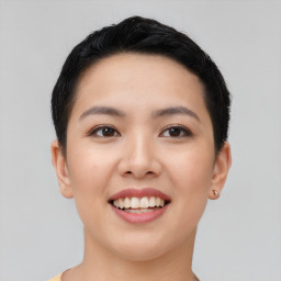 Joyful asian young-adult female with short  black hair and brown eyes