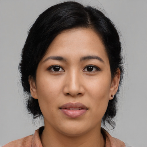 Joyful asian young-adult female with medium  black hair and brown eyes
