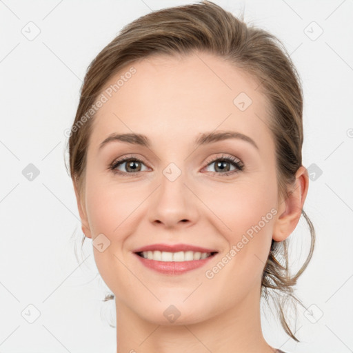 Joyful white young-adult female with medium  brown hair and blue eyes