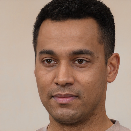 Neutral latino young-adult male with short  black hair and brown eyes