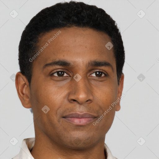 Joyful black young-adult male with short  brown hair and brown eyes