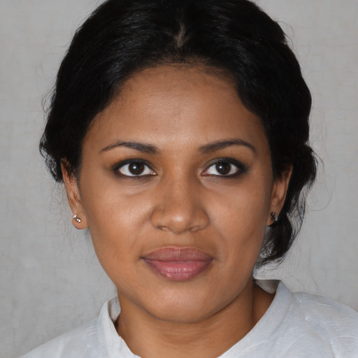 Joyful black young-adult female with medium  black hair and brown eyes