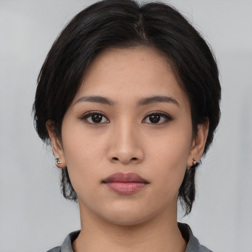 Neutral asian young-adult female with medium  black hair and brown eyes