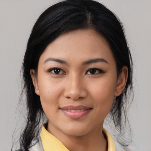 Joyful asian young-adult female with medium  black hair and brown eyes