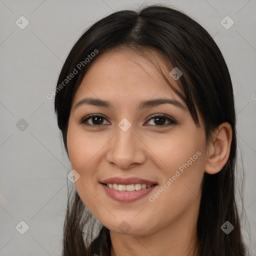 Joyful asian young-adult female with long  brown hair and brown eyes