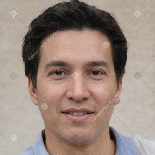 Joyful white adult male with short  black hair and brown eyes