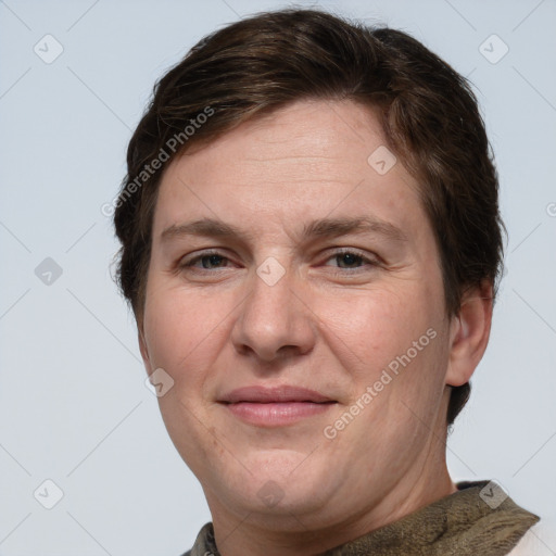 Joyful white adult male with short  brown hair and grey eyes