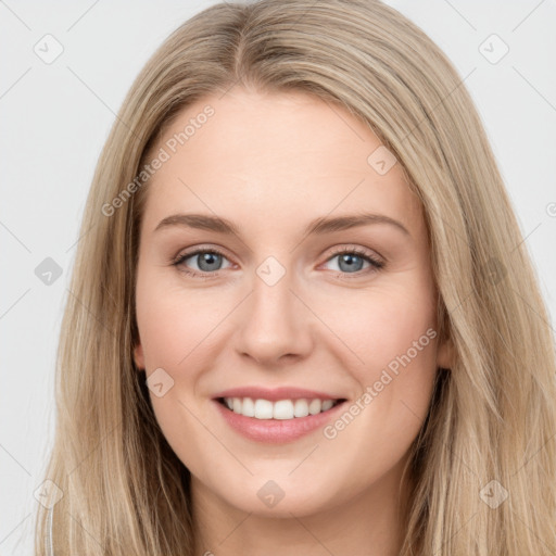 Joyful white young-adult female with long  brown hair and green eyes