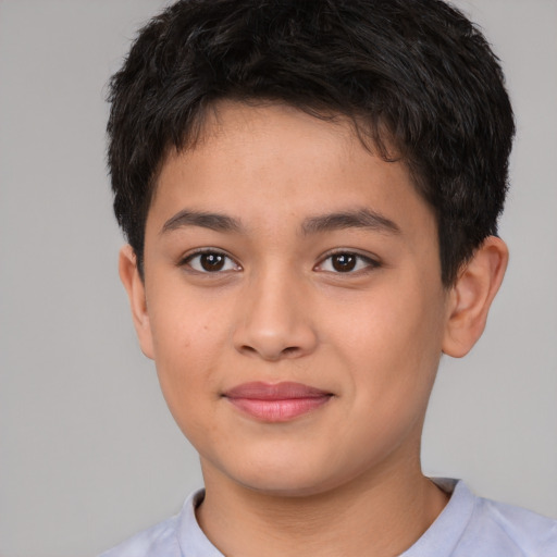 Joyful white child male with short  brown hair and brown eyes