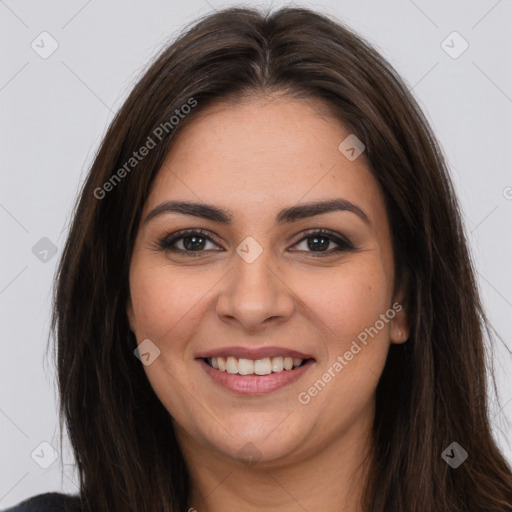 Joyful white young-adult female with long  brown hair and brown eyes