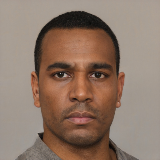 Neutral black young-adult male with short  black hair and brown eyes